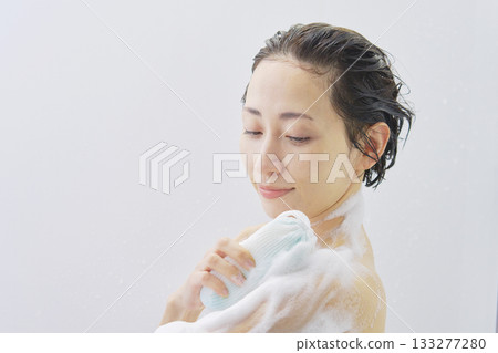 Woman washing body in the bathroom 133277280