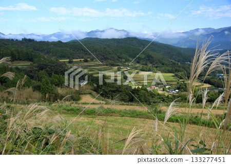 Scenery of a mountain village with terraced rice fields after the rice harvest Scenery of a mountain village with terraced rice fields after the rice harvest 133277451