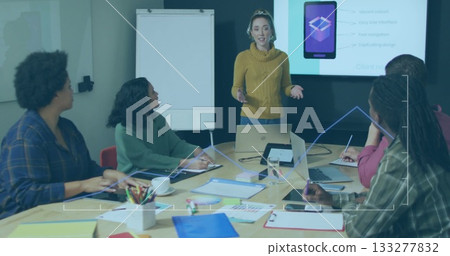 Presenting woman in yellow sweater leading meeting at conference room, with laptops and flipchart Presenting woman in yellow sweater leading meeting at conference room, with laptops and flipchart 133277832