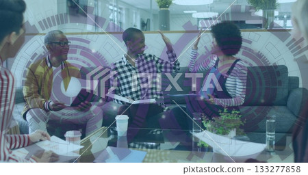 High-fiving two colleagues in checkered shirt and denim overalls at office lounge, with tablet High-fiving two colleagues in checkered shirt and denim overalls at office lounge, with tablet 133277858
