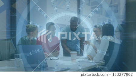 Discussing six professionals leaning over documents in office, with laptop, coffee and tech overlay Discussing six professionals leaning over documents in office, with laptop, coffee and tech overlay 133277902