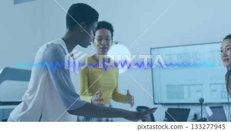 Leaning woman in pale pink gesturing at desk in meeting room, with waveform overlay, copy space 133277945