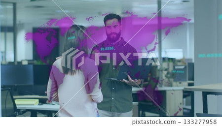 Presenting data coworker pair discussing trends in open-plan office, with laptop and map projection Presenting data coworker pair discussing trends in open-plan office, with laptop and map projection 133277958