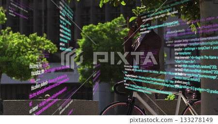 Leaning suit-clad man holding phone monitoring code next to white road bicycle in plaza, copy space Leaning suit-clad man holding phone monitoring code next to white road bicycle in plaza, copy space 133278149