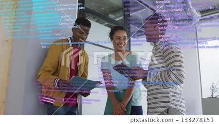 Standing three colleagues reviewing code on panel in office, with tablet, green folder and notebook Standing three colleagues reviewing code on panel in office, with tablet, green folder and notebook 133278151