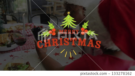 Holding smartphone, daughter wearing Santa hat showing photos to father in dining room, lit candle Holding smartphone, daughter wearing Santa hat showing photos to father in dining room, lit candle 133278162