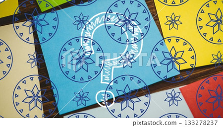 Displaying colorful card grid on wood table, with blue chalk question mark and snowflake overlay Displaying colorful card grid on wood table, with blue chalk question mark and snowflake overlay 133278237