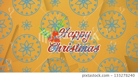 Displaying greeting with red outlined script on orange backdrop, with holly sprig and blue motifs 133278240