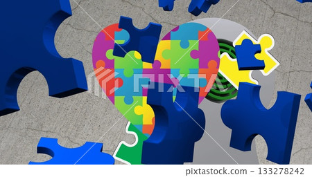 Floating multicolored puzzle-piece heart forming on grey concrete, with blue fragments, green vent Floating multicolored puzzle-piece heart forming on grey concrete, with blue fragments, green vent 133278242