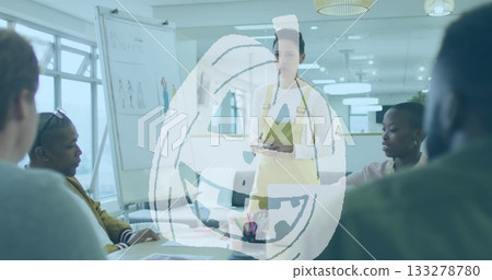 Presenter wearing yellow apron holding tablet with stylus in office with whiteboard sketches Presenter wearing yellow apron holding tablet with stylus in office with whiteboard sketches 133278780