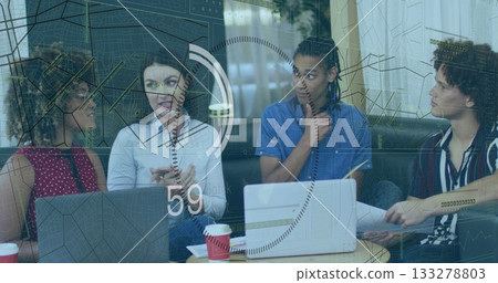 Gesturing project lead presenting floating data charts at office lounge, with laptops and documents Gesturing project lead presenting floating data charts at office lounge, with laptops and documents 133278803
