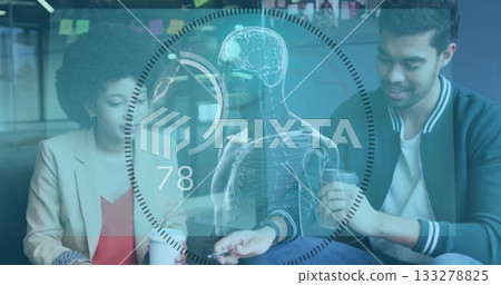 Two tech professionals studying skeleton brain hologram in modern office lounge, with coffee mugs 133278825