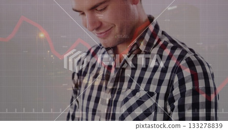 Analyzing checkered shirt man reviewing red line graph in studio, with gridlines and axis labels Analyzing checkered shirt man reviewing red line graph in studio, with gridlines and axis labels 133278839