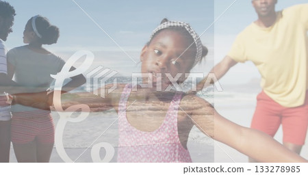 Spreading arms girl wearing pink swimsuit and gingham headband on sandy beach, family scene 133278985