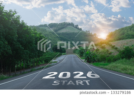 A Scenic Open Road Leading Towards a Bright Future with 2026 Start Marked on the Asphalt Surrounded by Lush Green Hills and a Cloudy Sky A Scenic Open Road Leading Towards a Bright Future with 2026 Start Marked on the Asphalt Surrounded by Lush Green Hills and a Cloudy Sky 133279186