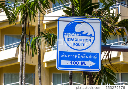 Evacuation route arrow beach direction sign signs Patong Phuket Thailand. Evacuation route arrow beach direction sign signs Patong Phuket Thailand. 133279376