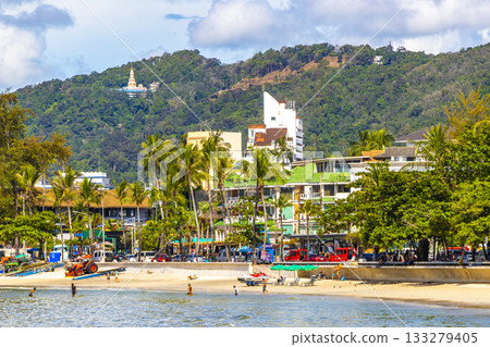 Patong Beach Phuket with people promenade sun loungers parasols Thailand. 133279405