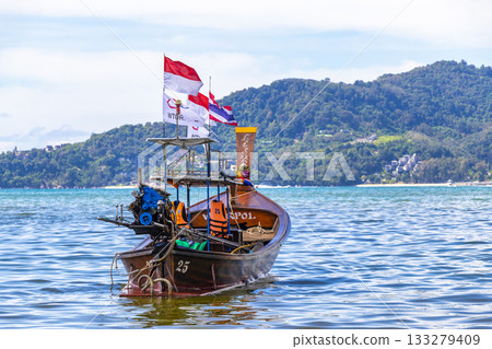 Longtail boat long tail boats at the Patong Beach Thailand. Longtail boat long tail boats at the Patong Beach Thailand. 133279409