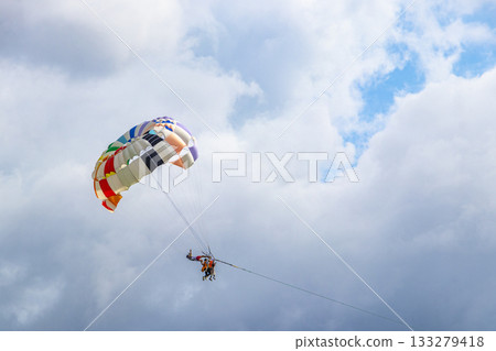 Patong Beach Phuket with parachute sport and parasailing activity Thailand. 133279418