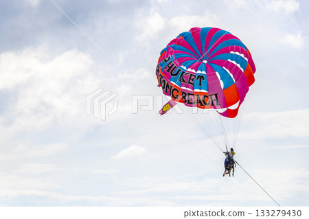 Patong Beach Phuket with parachute sport and parasailing activity Thailand. 133279430