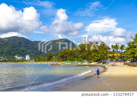 Patong Beach Phuket with promenade boats turquoise blue water Thailand. Patong Beach Phuket with promenade boats turquoise blue water Thailand. 133279457