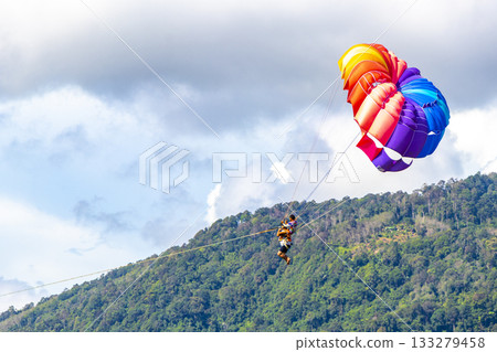 Patong Beach Phuket with parachute sport and parasailing activity Thailand. Patong Beach Phuket with parachute sport and parasailing activity Thailand. 133279458