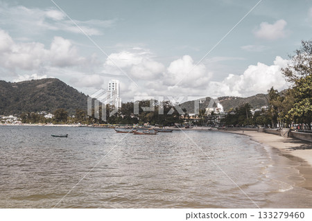 Patong Beach Phuket with promenade boats turquoise blue water Thailand. Patong Beach Phuket with promenade boats turquoise blue water Thailand. 133279460
