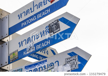 Surfboard and arrow beach direction sign signs Patong Phuket Thailand. Surfboard and arrow beach direction sign signs Patong Phuket Thailand. 133279479