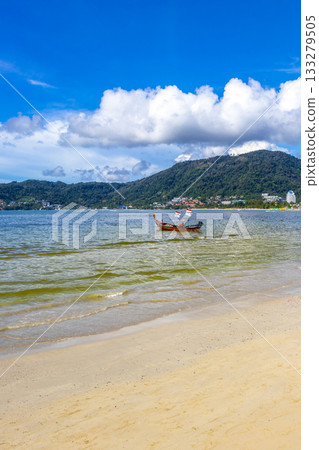 Longtail boat long tail boats at the Patong Beach Thailand. Longtail boat long tail boats at the Patong Beach Thailand. 133279505