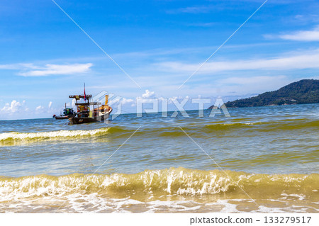 Longtail boat long tail boats at the Patong Beach Thailand. Longtail boat long tail boats at the Patong Beach Thailand. 133279517
