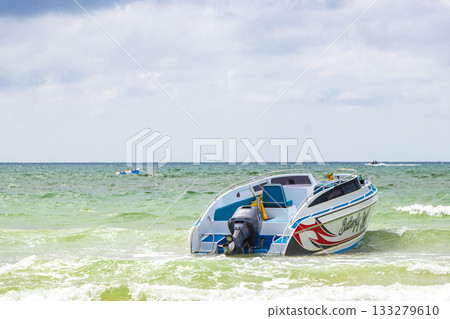 Speed boat yacht boats turquoise blue water Patong Beach Thailand. 133279610