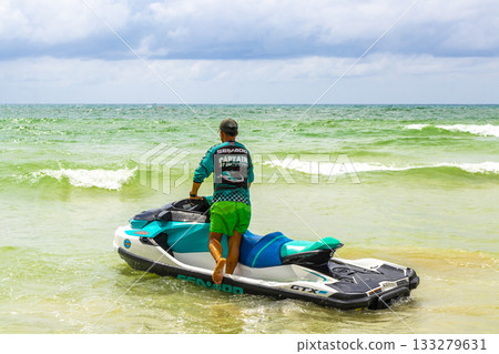Jet ski jetski in turquoise blue water Patong Beach Thailand. Jet ski jetski in turquoise blue water Patong Beach Thailand. 133279631