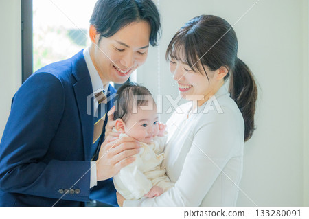 Baby and working couple Baby and working couple 133280091