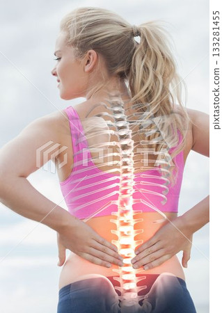 Highlighted spine of woman with back pain Highlighted spine of woman with back pain 133281455