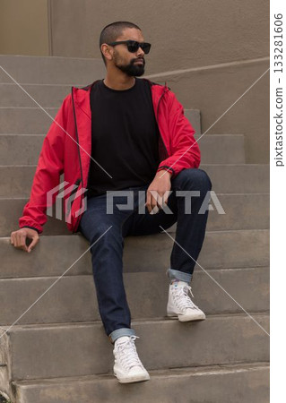 Flat design man is sitting on concrete staircase wearing red jacket sunglasses sneakers Flat design man is sitting on concrete staircase wearing red jacket sunglasses sneakers 133281606