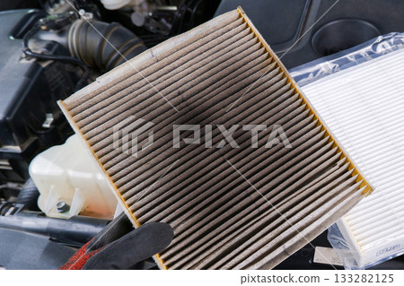 Old, clogged air filter removed from air system. 133282125