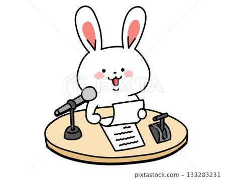 A cute rabbit reading a script in front of a microphone 133283231