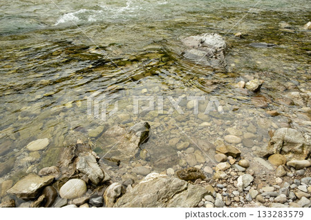 River Flow Over Rocky Bottom, Natural Water Background River Flow Over Rocky Bottom, Natural Water Background 133283579