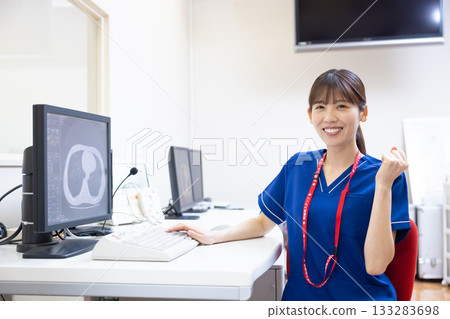 A radiologist looks at the results of a CT scan on a monitor. Photo courtesy of Denpa Gakuen, Tokyo Electronics College. A radiologist looks at the results of a CT scan on a monitor. Photo courtesy of Denpa Gakuen, Tokyo Electronics College. 133283698
