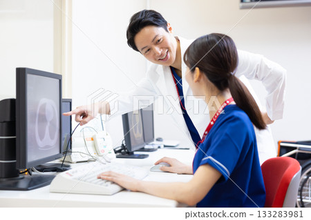 A radiologist looks at the results of a CT scan on a monitor. Photo courtesy of Denpa Gakuen, Tokyo Electronics College. A radiologist looks at the results of a CT scan on a monitor. Photo courtesy of Denpa Gakuen, Tokyo Electronics College. 133283981