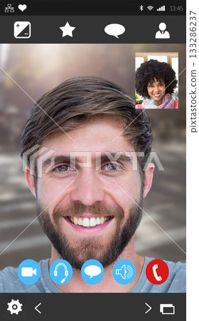 Bearded man is smiling during call with UI icons, blurred crosswalk background, inset woman smiling 133286237