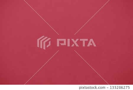 Uniform red textured surface is covering entire frame in flat design, creating bold backdrop 133286275