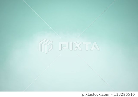 Irregular white cloud-like shape is floating on flat gradient design backdrop with vignette 133286510