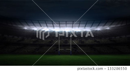White rugby goalposts are rising in flat design stadium under bright floodlights with green turf 133286550