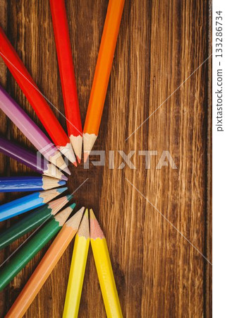 Color pencils arranged on wooden table 133286734