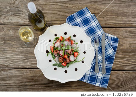 Fresh food with white wine served in wooden table Fresh food with white wine served in wooden table 133286789