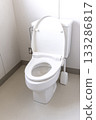 A clean white toilet with the lid open 133286817