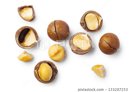 Macadamia nuts with cracked nut and shell isolated on white background, top view Macadamia nuts with cracked nut and shell isolated on white background, top view 133287253