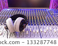 headphone on audio mixing console in studio. broadcasting, recording, music production concept 133287748