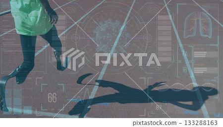 Sprinting runner with carbon-fiber blade prosthetic on red track showing HUD data, copy space Sprinting runner with carbon-fiber blade prosthetic on red track showing HUD data, copy space 133288163